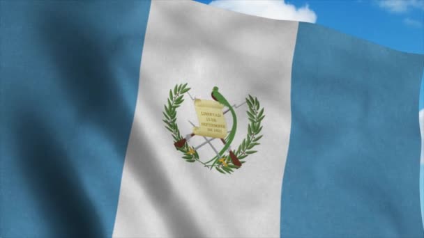 Guatemala flagga viftar i vinden, blå himmel bakgrund. 4K — Stockvideo