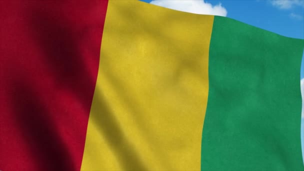 Bandiera della Guinea sventola nel vento, sfondo cielo blu. 4K — Video Stock