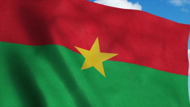 Флаг Буркина-Фасо, развевающийся на ветру, голубое небо. 4K — стоковое видео