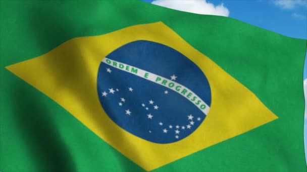 Bandera de Brasil ondeando en el viento, fondo cielo azul. 4K — Vídeo de stock