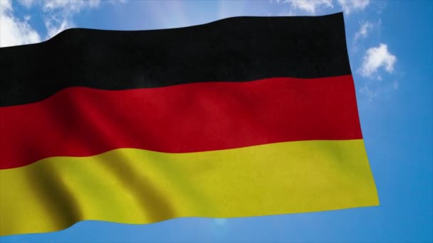 Bandera de Alemania ondeando en el viento, fondo azul del cielo. 4K — Vídeos de Stock