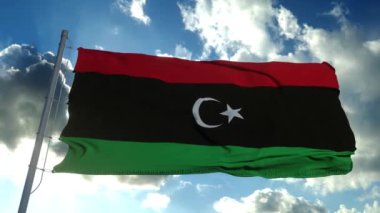 Libya Ulusal bayrağı rüzgarda dalgalanıyor, mavi gökyüzü arkaplanı