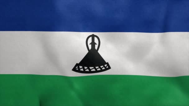 Государственный флаг Лесото развевается на ветру. Бесшовный цикл — стоковое видео