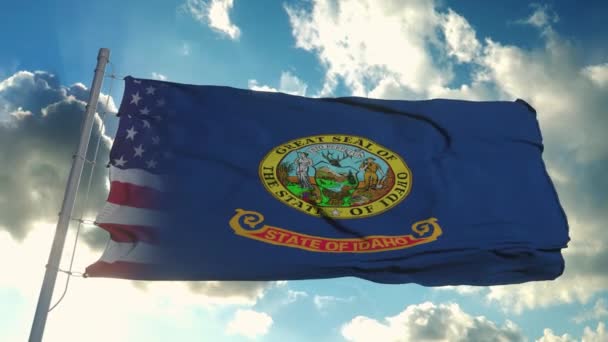 Stát vlajky USA a Idaho. USA a Idaho Smíšené vlajky vlnící se ve větru — Stock video