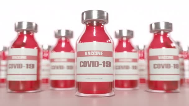 Conceito da vacina contra o Coronavírus Covid-19. Medicamentos farmacológicos contra a pandemia Covid-19. Frasco de vacina médica — Vídeo de Stock