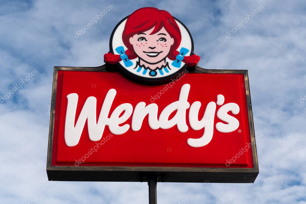 STILLWATER, MN/USA - JANUARY 18, 2021: Wendy's restaurant sign and trademark logo.