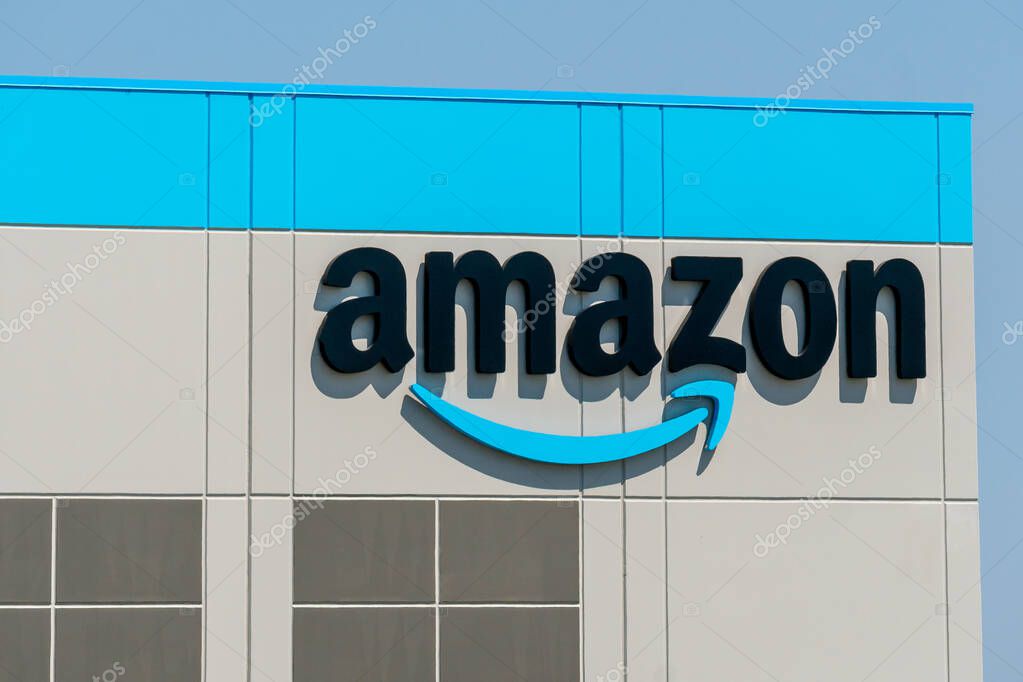 KENOSHA, WI,USA - JUNE 19, 2021 - Amazon warehouse facility exterior and trademark logo.