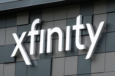 MINNEAPOLIS, MN, USA - AUGUST 8, 2021: Xfinity retail store exterior and trademark logo. clipart