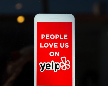 Yelp Emblem and Logo on Business Exterior clipart