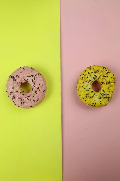 Sweet donut with colored background — Stock Photo, Image