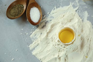 ingredients for homemade pasta. Food background: macaroni, spagetti, egg, flour