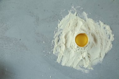 ingredients for homemade pasta. Food background: macaroni, spagetti, egg, flour