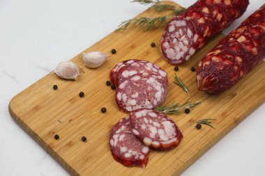 Smoked pork sausages, isolated on white background.