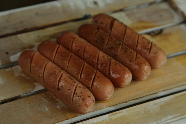 Smoked pork sausages, isolated on white background. — Stock fotografie