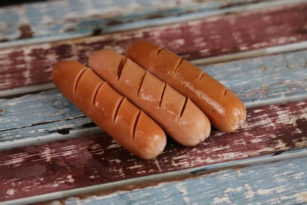 Smoked pork sausages, isolated on white background. — Stock fotografie