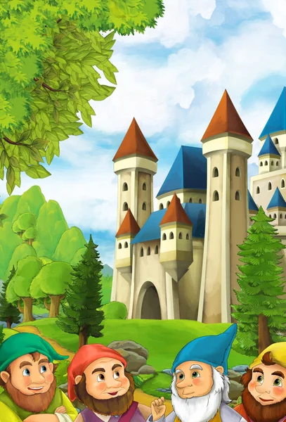 Карлики рядом с большим и красочным замком — стоковое фото