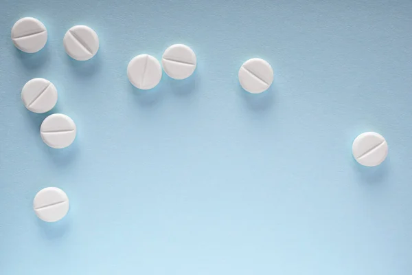 White Pills Lie Sheet Blue Paper Close Light Background Backdrop — Stock Photo, Image