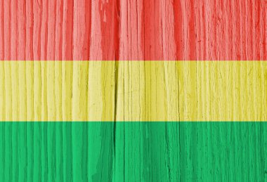 Bolivya bayrağı kuru ahşap yüzeyde, yaşla çatlamış. Açık soluk soluk boya. Arkaplan, duvar kağıdı ya da Bolivya ulusal sembolü olan bir fon. Eski tahta. Gölgeli sert güneş ışığı