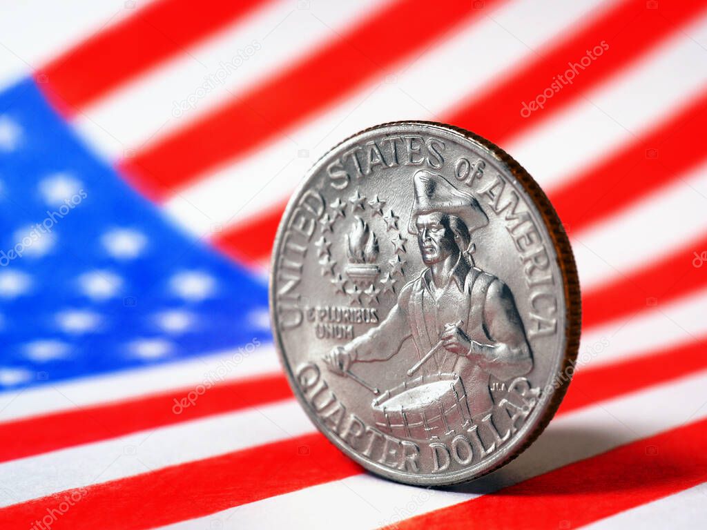US quarter dollar coin with drummer close up and USA flag. Stars and stripes in the blur. Beautiful illustration of American patriotism and Independence Day July 4. Macro