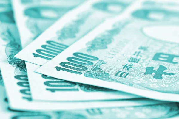 Close Several Japanese 000 Yen Bills Light Turquoise Tinted Backdrop — Stock Photo, Image