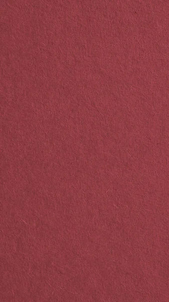 Kahverengi karton yüzeyi. Selüloz lifli kağıt dokusu. Dikey arkaplan. Kağıt cep telefonu duvar kâğıdı. Zarif ve evin arka planı. Makro