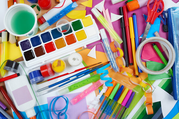 artwork workplace with creative accessories, art tools for painting and drawing