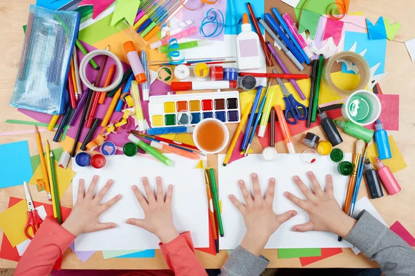 Child drawing top view. Artwork workplace with creative accessories. Flat lay art tools for painting. — Stock Photo, Image