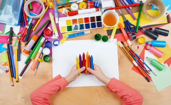 Child drawing top view. Artwork workplace with creative accessories. Flat lay art tools for painting. — Stock Photo, Image