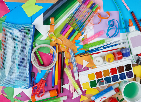 artwork workplace with creative accessories, art tools for painting and drawing