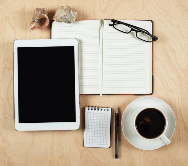 Flat lay of tablet computer, notebook, coffee cup  and pencil with blank center on wood background, top view — Stock Photo, Image