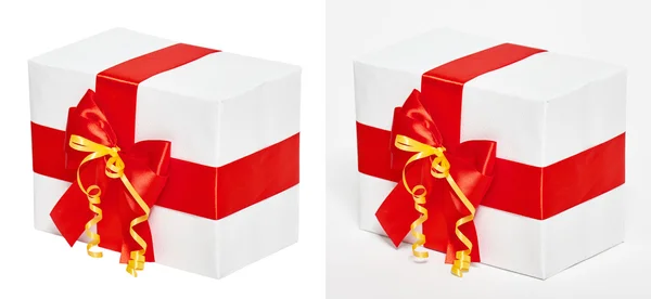 Caja de regalo decorada con cinta roja de seda y lazo, objeto sobre fondo blanco estudio — Foto de Stock