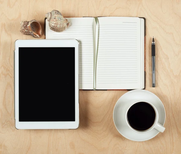 Flat lay of tablet computer, notebook, coffee cup  and pencil with blank center on wood background, top view — Stock Photo, Image