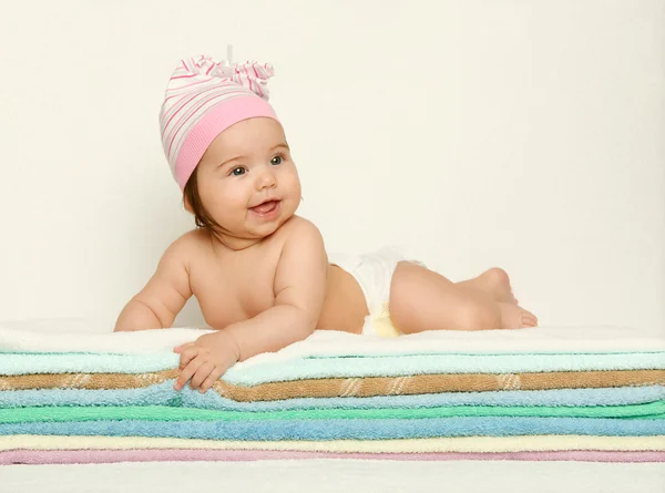 Baby portrait in diaper on towel at studio, yellow toned background — Stock Photo, Image