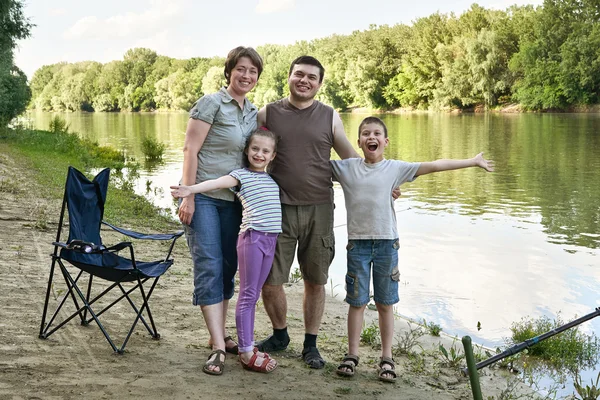 People camping and fishing, family active in nature, fish caught on bait, river and forest, summer season — Stock Photo, Image