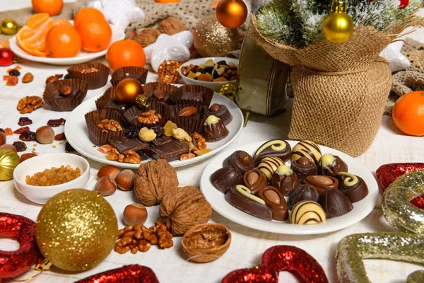 Sweet Food Background Christmas Holiday Decoration Chocolate Candies Tangerines Nuts — Stock Photo, Image
