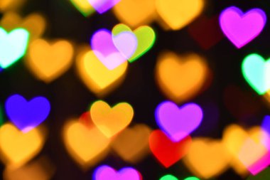 Tatil ya da soyut sahte arkaplan için renkli kalp aydınlatması