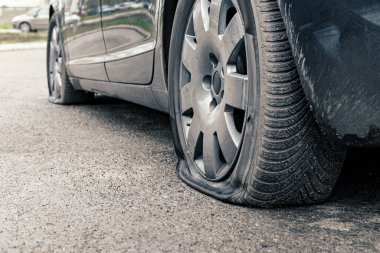 flat car tire close up, punctured wheel clipart