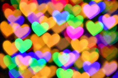 Tatil ya da soyut sahte arkaplan için renkli kalp aydınlatması