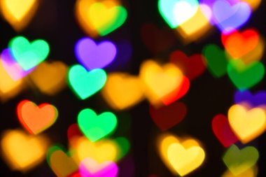 Tatil ya da soyut sahte arkaplan için renkli kalp aydınlatması