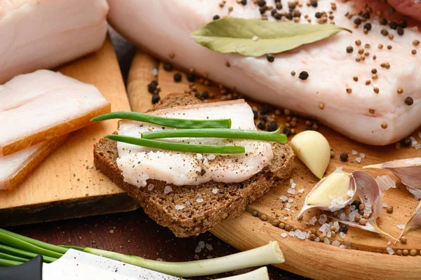 Raw Pork Meat Lard Salt Spices Garlic Cutting Board Dark — Stock Photo, Image