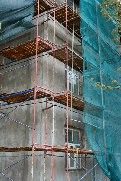 renovation or repair of a building facade using scaffolding