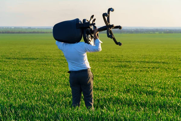 Businessman Carries Office Chair Field Work Freelance Business Concept Green — Stock Photo, Image