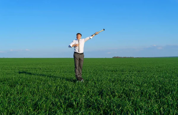 Businessman Poses Spyglass Green Field Looks Idea Something Business Concept — Stock Photo, Image