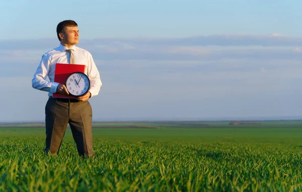 Businessman Holds Office Clock Red Folder Field Green Grass Business — Stock Photo, Image