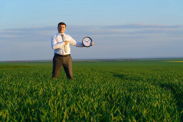 Businessman Holds Office Clock Field Green Grass Business Time Concept — Stock Photo, Image