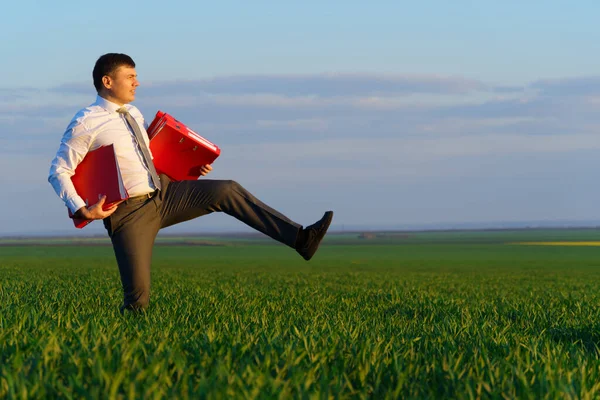 Businessman Walks Green Grass Field Holds Office Red Folder Documents — Stock Photo, Image