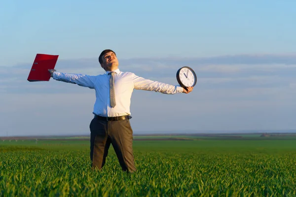 Businessman Holds Office Clock Red Folder Field Green Grass Business — Stock Photo, Image