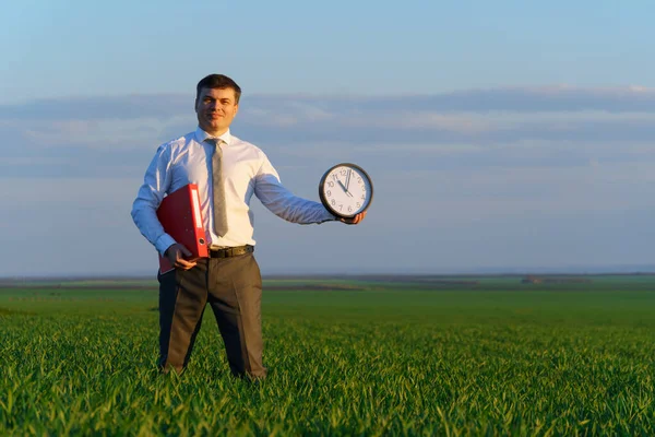 Businessman Holds Office Clock Red Folder Field Green Grass Business — Stock Photo, Image