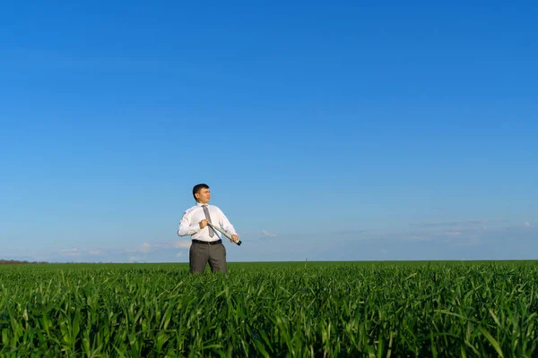 Businessman Poses Spyglass Looks Distance Looks Something Green Grass Blue — Stock Photo, Image