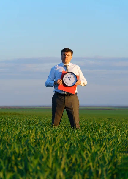 Businessman Holds Office Clock Red Folder Field Green Grass Business — Stock Photo, Image